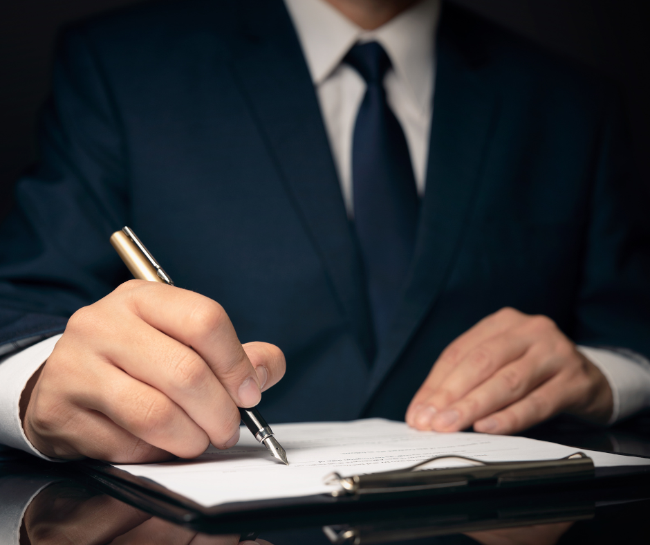 Obraz przedstawiajcy mczyzn podpisujcego dokumenty